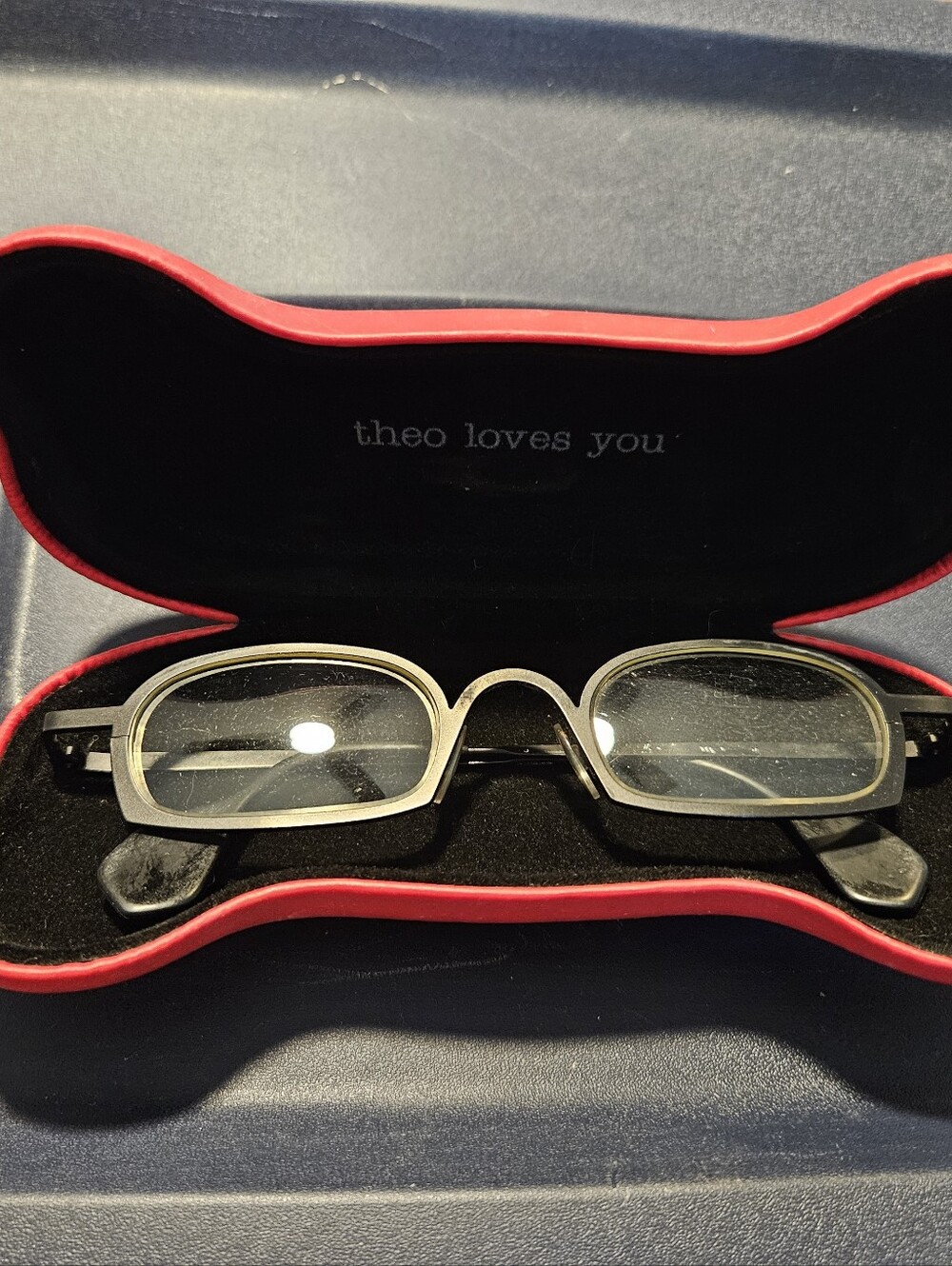 Designer Theo Loves You Rectangular Glasses in Black and Silver.